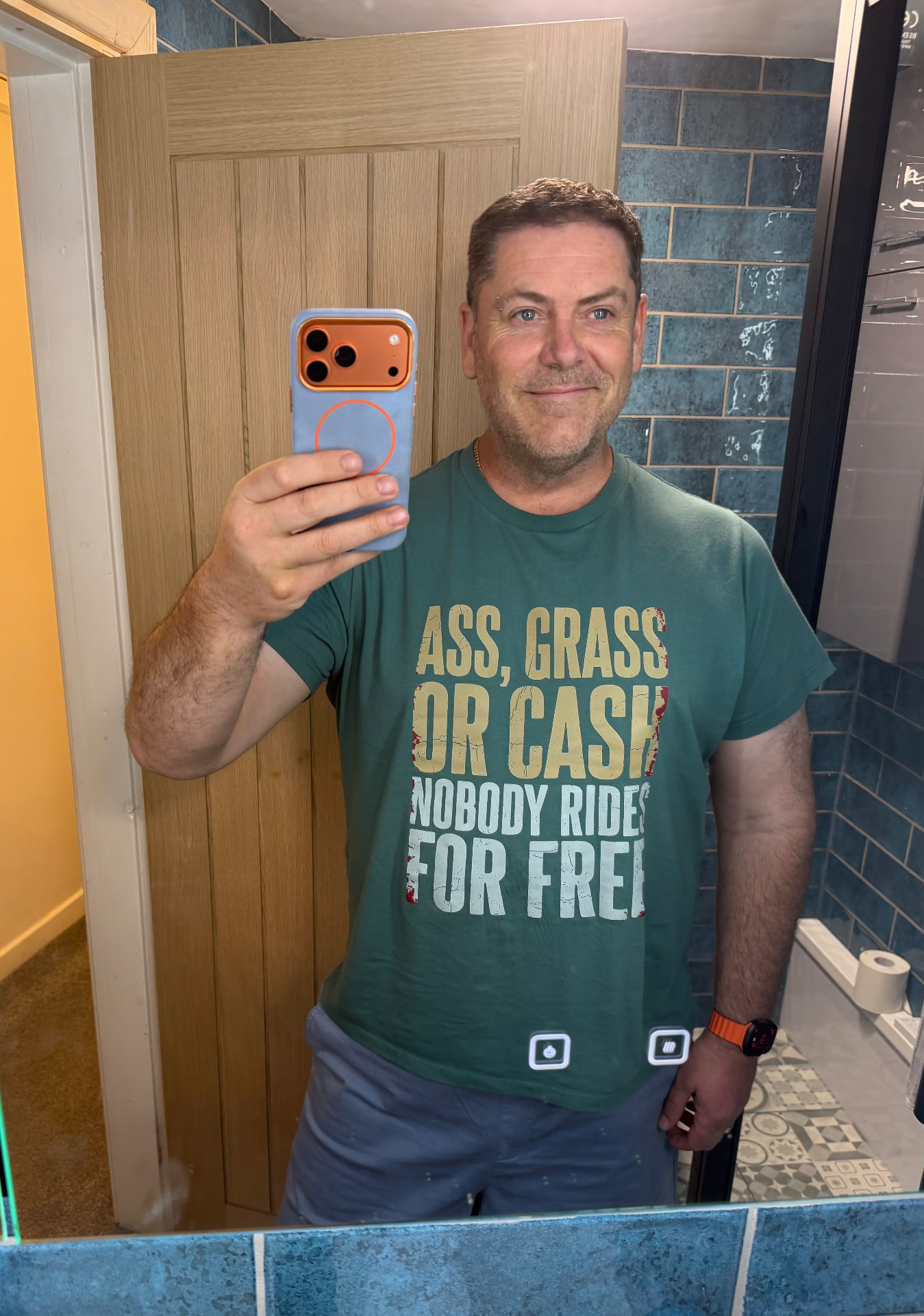 David wearing the Ass, Grass or Cash T-shirt